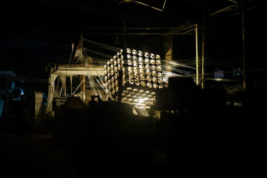 Illuminated sculptural installation in a darkened studio at Dayhim Art Society
